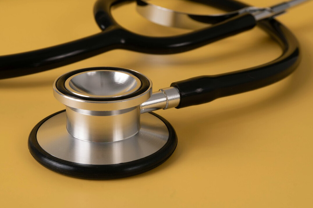 Stethoscope lying on a white table