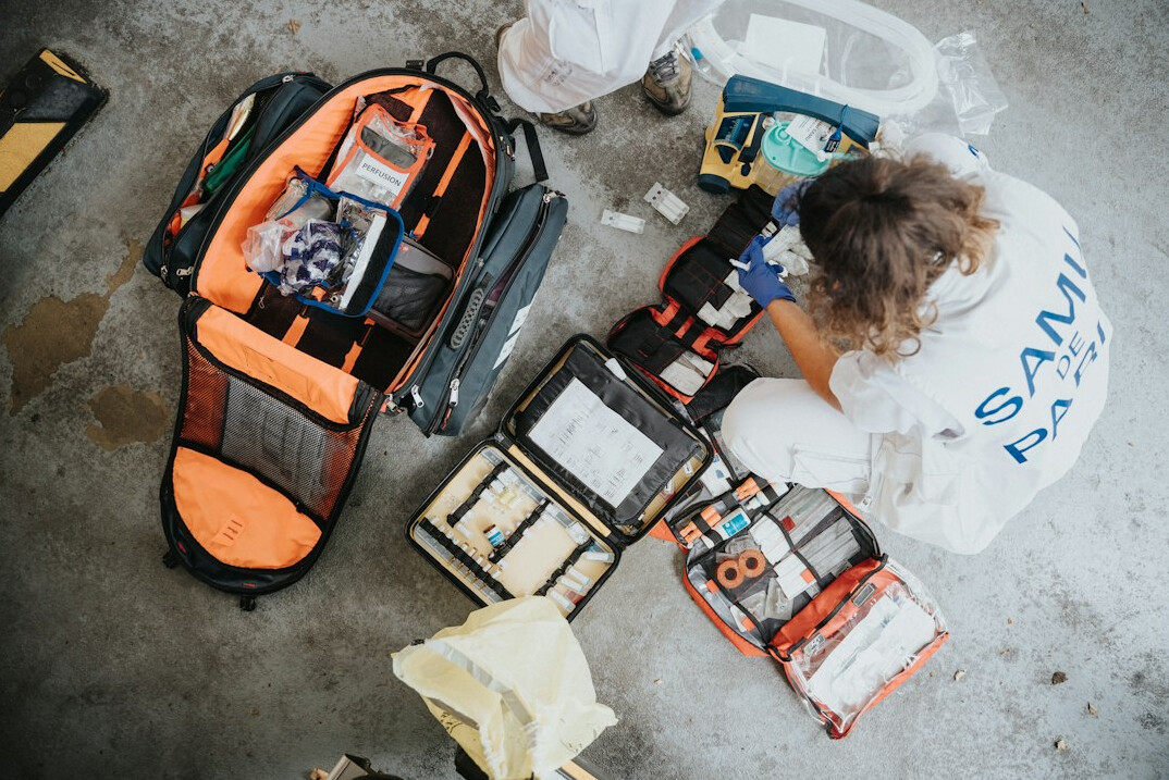 Open first aid kit with bandages and supplies
