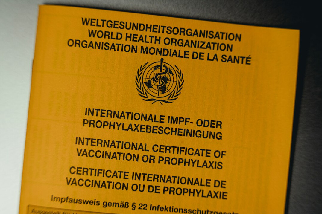 Certificate and pen with stethoscope on a wooden desk