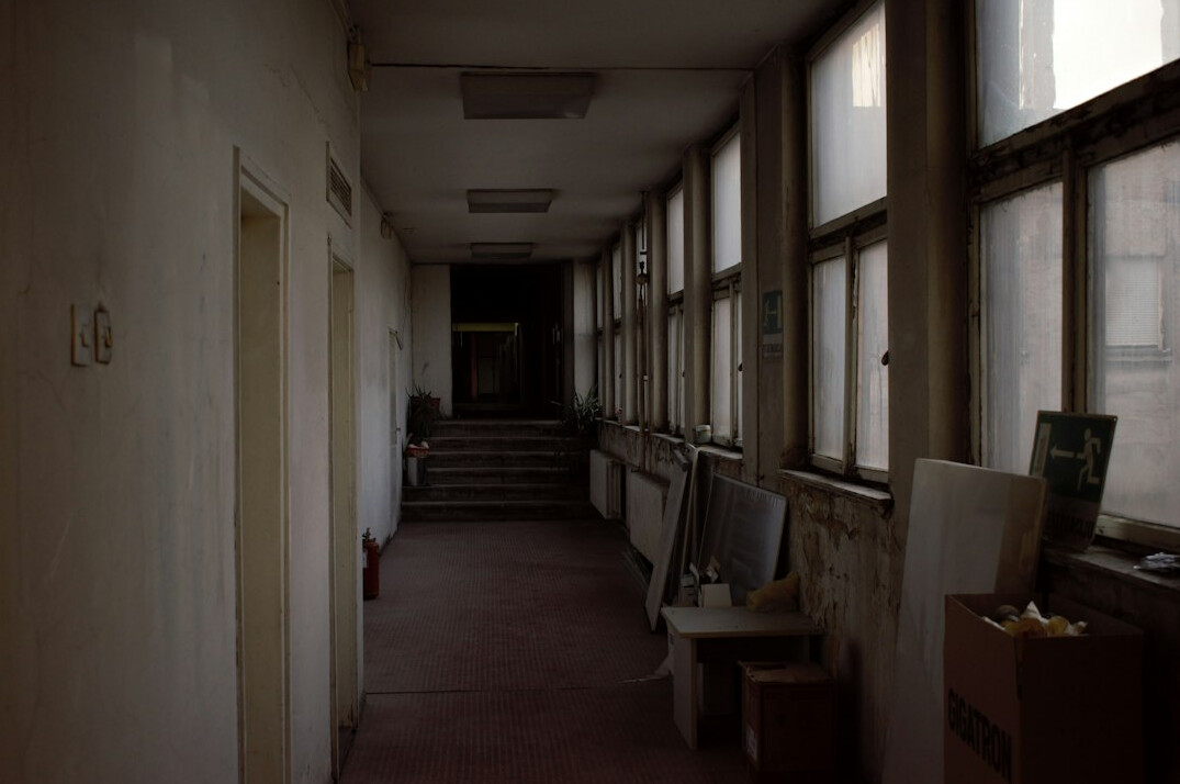 Clean bright hospital corridor with large windows